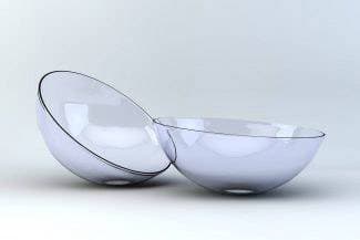 Two specialty contact lenses on a light background